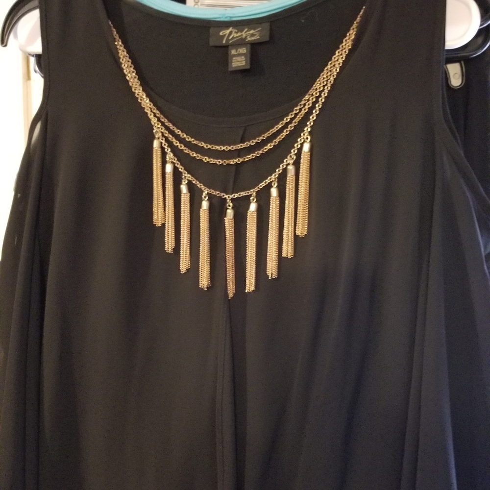 Flowing blouse with necklace